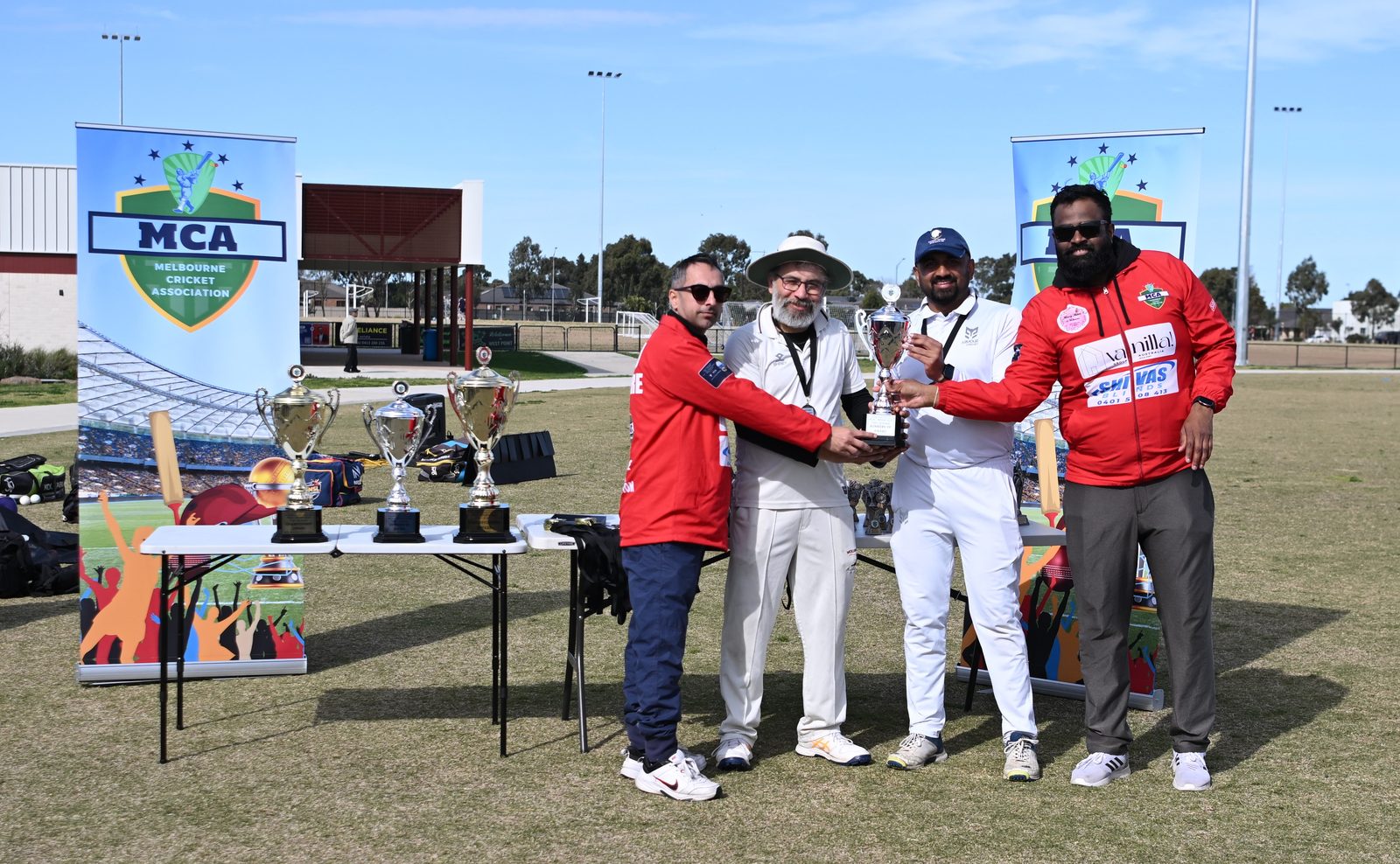 MCA umpires presenting the runners-up award to the Rockbank Blues captain